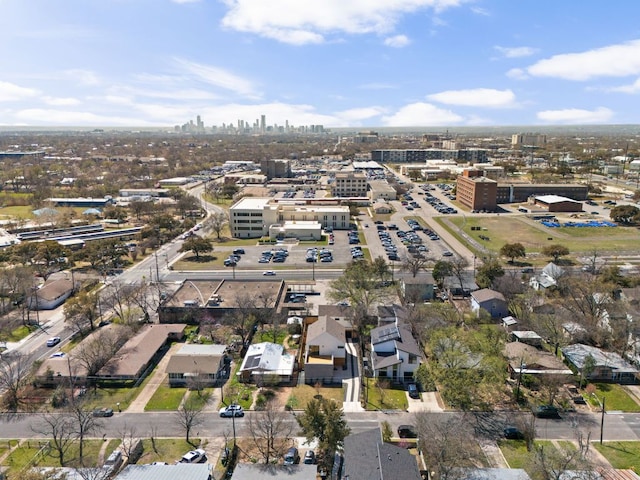 birds eye view of property with a view of city