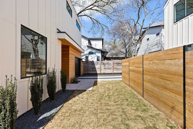 view of yard with a fenced backyard