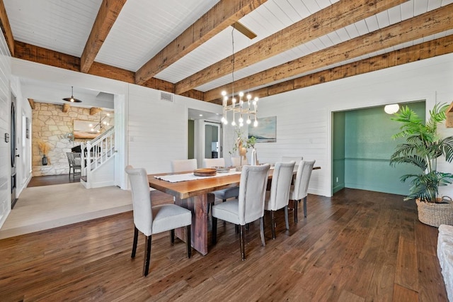 dining room featuring dark wood-style floors, beamed ceiling, stairs, and an inviting chandelier