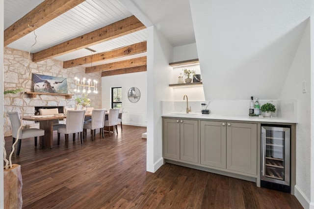 bar with wine cooler, beamed ceiling, wet bar, dark wood-style floors, and a sink