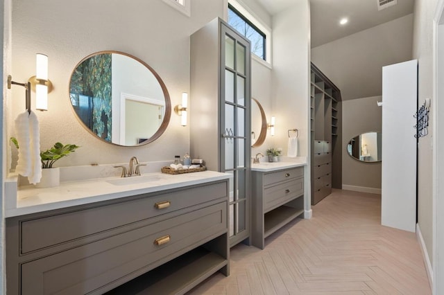 bathroom with vanity and visible vents