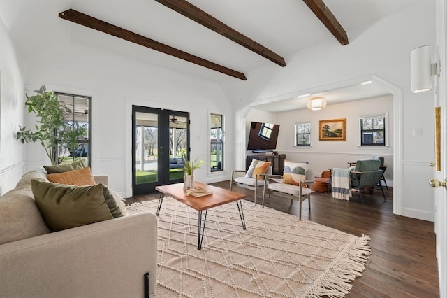 living room featuring beamed ceiling, french doors, baseboards, and wood finished floors