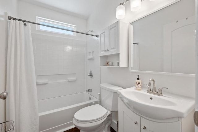 bathroom featuring vanity, toilet, and shower / tub combo with curtain