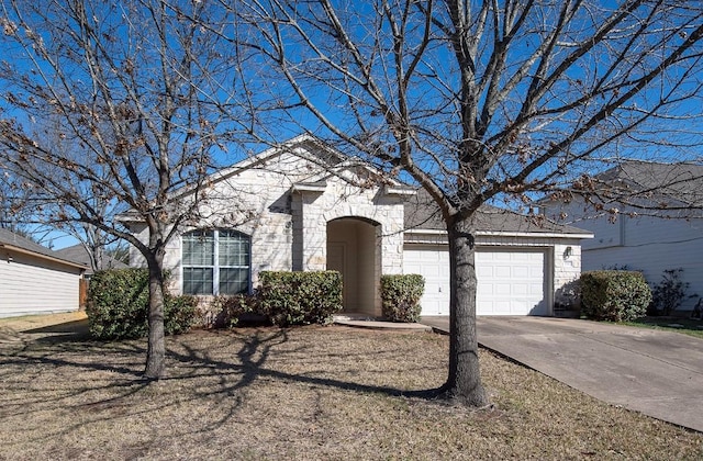 view of front facade with driveway and an attached garage