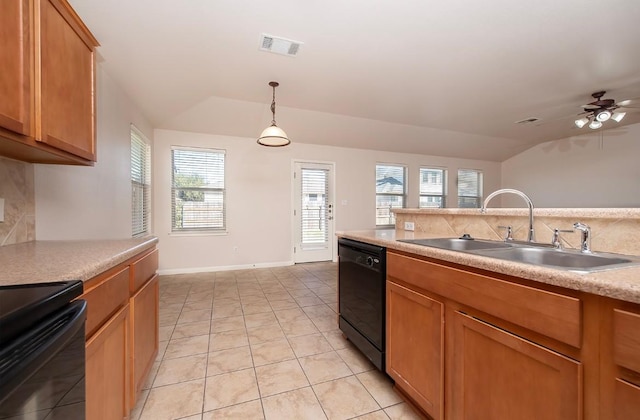 kitchen with visible vents, light countertops, black dishwasher, decorative backsplash, and a sink