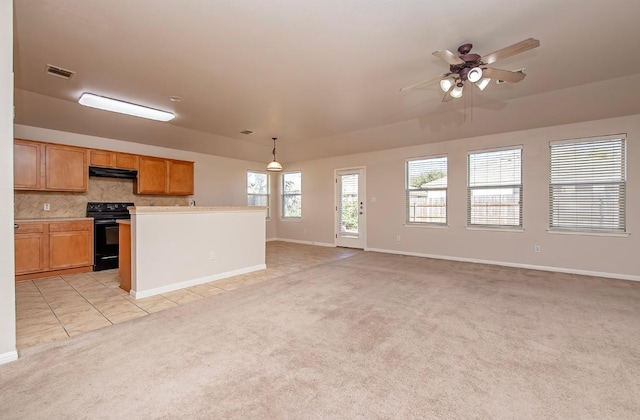 unfurnished living room featuring visible vents, baseboards, ceiling fan, light colored carpet, and light tile patterned floors