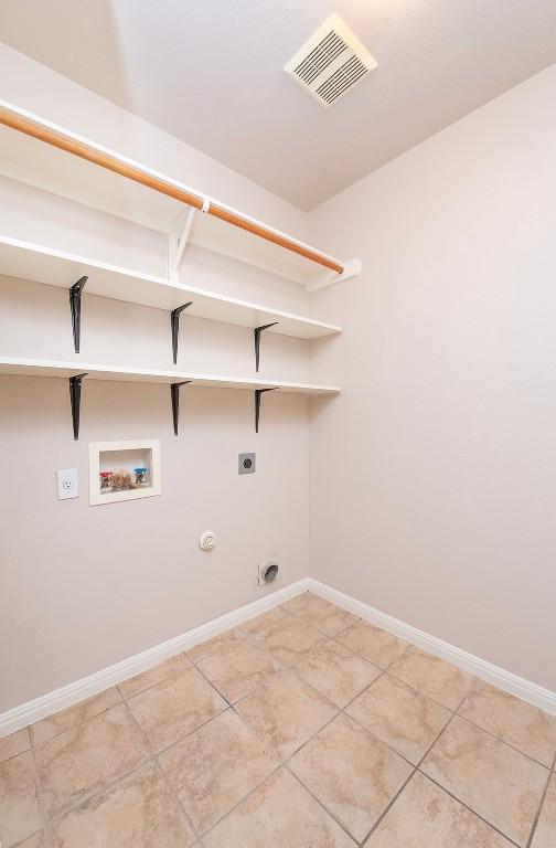 laundry room with visible vents, gas dryer hookup, laundry area, hookup for a washing machine, and electric dryer hookup