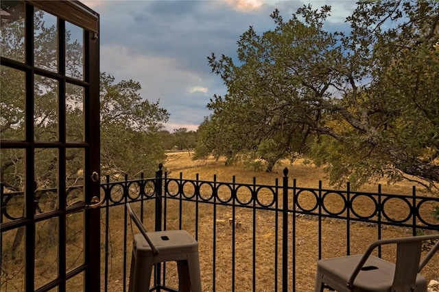 view of balcony at dusk