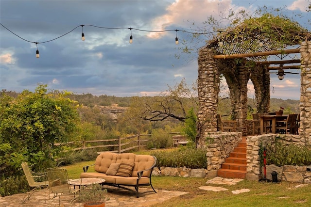 view of yard with an outdoor living space, fence, and a patio area