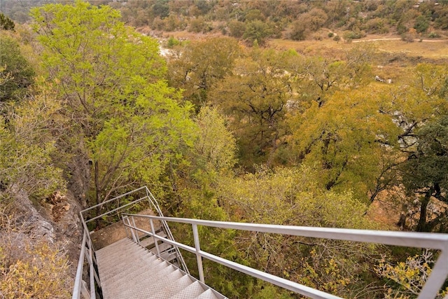 exterior space featuring a forest view