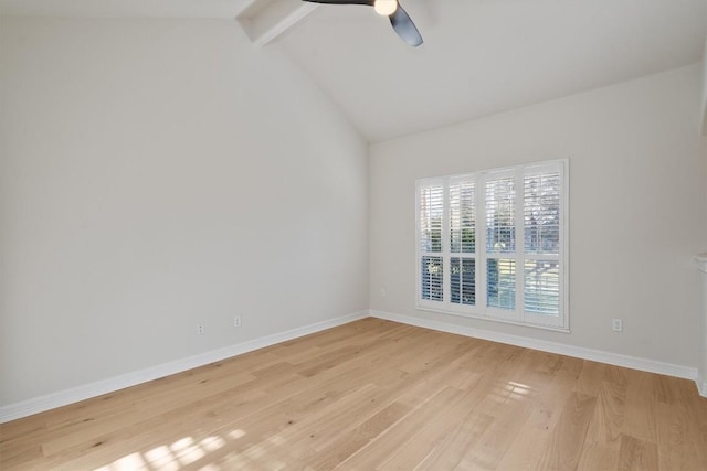 spare room with lofted ceiling with beams, baseboards, light wood-style floors, and ceiling fan