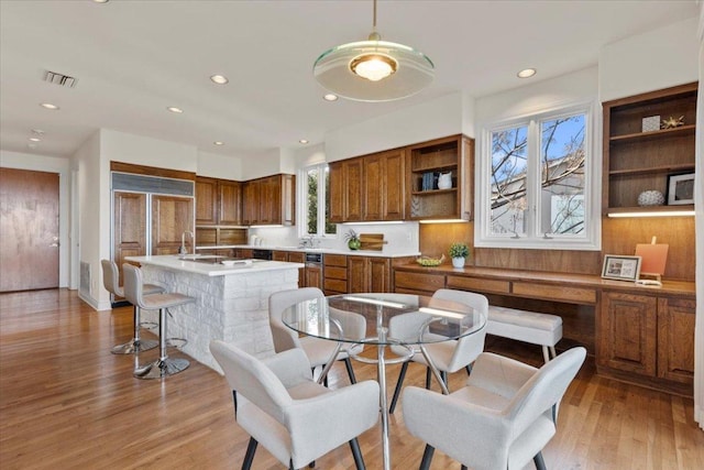 dining room featuring recessed lighting, light wood-style floors, and visible vents