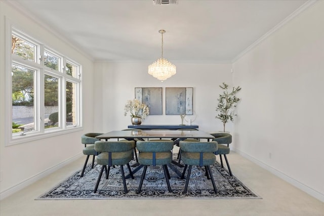 dining space with crown molding, a notable chandelier, and baseboards