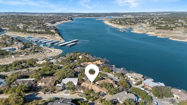 drone / aerial view featuring a residential view and a water view