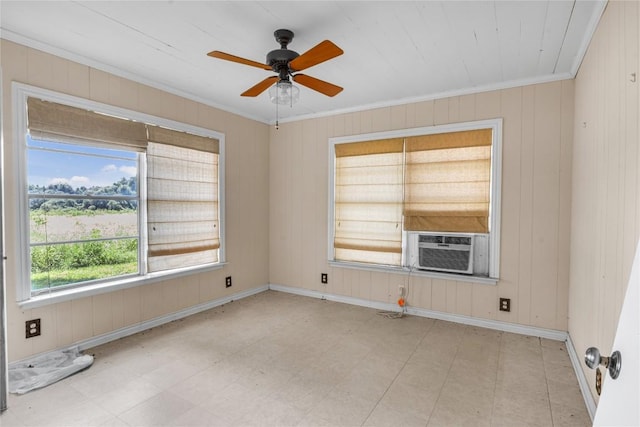 451 Pleasant Grove Rd, Elgin, TX 78621 - unfurnished room with crown molding, a ceiling fan, baseboards, wooden walls, and cooling unit