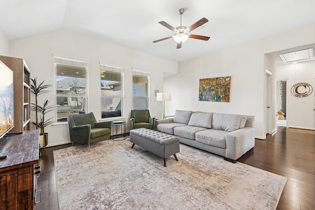 living room with lofted ceiling, hardwood / wood-style floors, baseboards, attic access, and ceiling fan