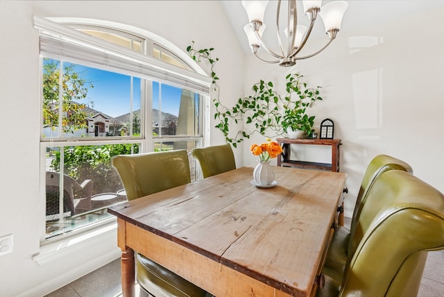 dining area with an inviting chandelier