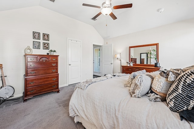 carpeted bedroom with baseboards, ceiling fan, and vaulted ceiling