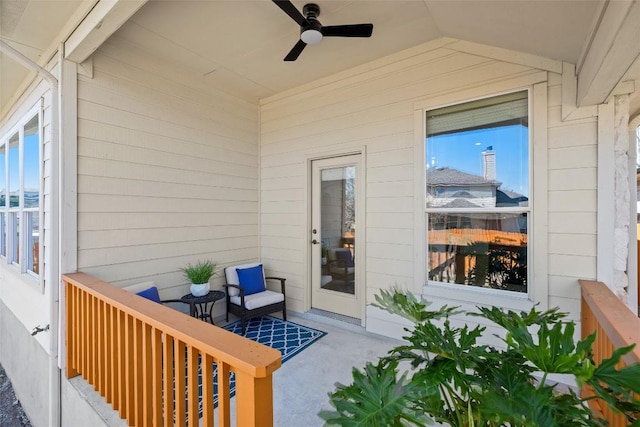 view of exterior entry featuring a ceiling fan