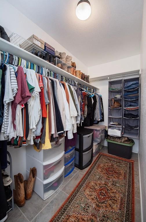 spacious closet featuring tile patterned flooring