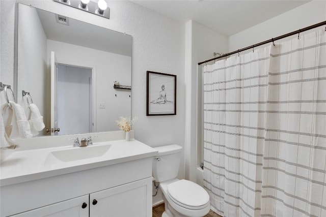 bathroom with visible vents, toilet, vanity, and shower / bathtub combination with curtain