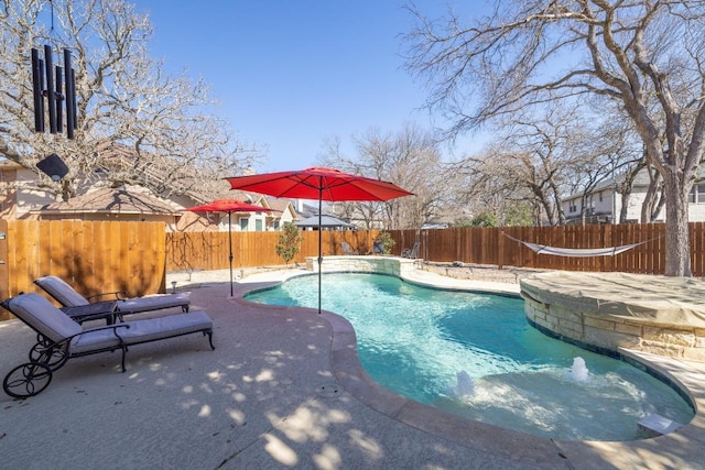 view of swimming pool with a patio area, a fenced backyard, and a fenced in pool