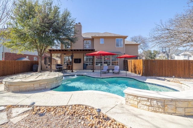 view of swimming pool with a fenced in pool, a patio, and a fenced backyard