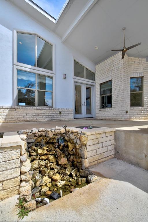 view of patio / terrace featuring french doors and a ceiling fan