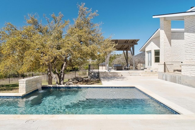 view of pool with a patio area, fence, and a fenced in pool