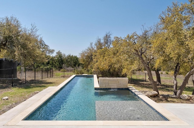 view of swimming pool with a fenced in pool and fence