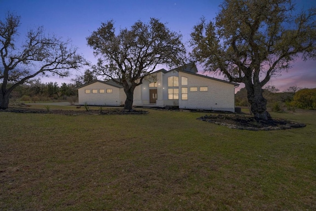 view of front of home featuring a yard