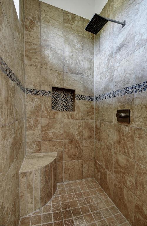 bathroom with a tile shower