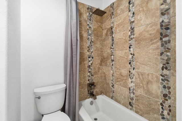 bathroom featuring toilet and shower / tub combo with curtain