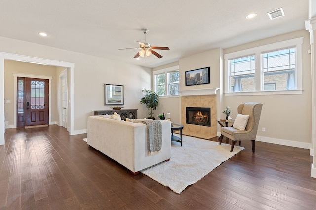 living room with a fireplace, ceiling fan, baseboards, dark wood-type flooring, and recessed lighting