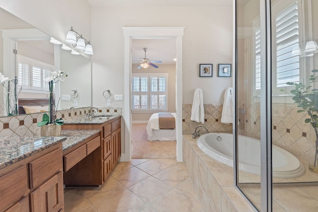 3129 Mill Stream Dr, Cedar Park, TX 78613 - ensuite bathroom with tile patterned flooring, a ceiling fan, a garden tub, vanity, and healthy amount of natural light