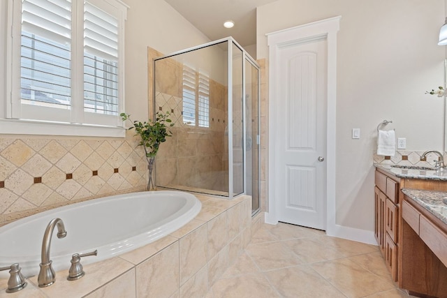 3129 Mill Stream Dr, Cedar Park, TX 78613 - bathroom featuring vanity, a garden tub, a shower stall, and tile patterned flooring