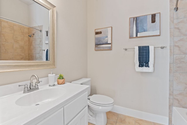bathroom featuring toilet, tile patterned flooring, vanity, and baseboards