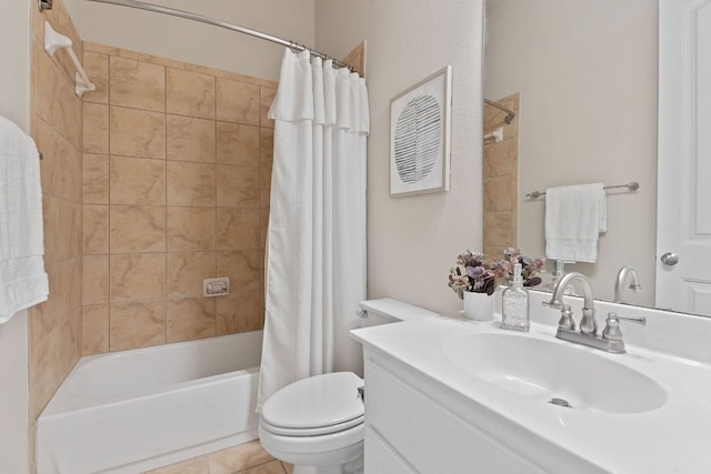 full bath featuring shower / tub combo with curtain, toilet, vanity, and tile patterned floors