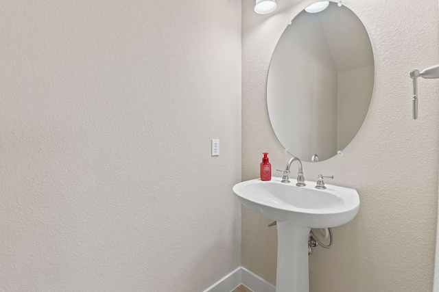 bathroom with a textured wall