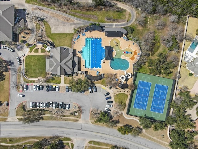 aerial view of property and surrounding area featuring a pool