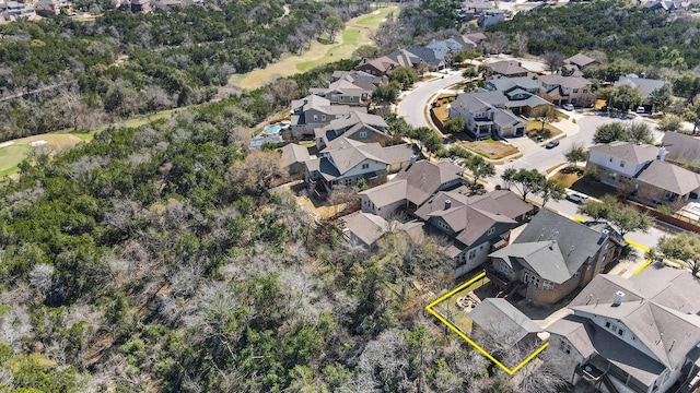 aerial view of property and surrounding area featuring nearby suburban area