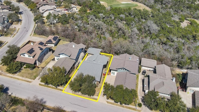 aerial view of residential area featuring property parcel outlined and a golf club