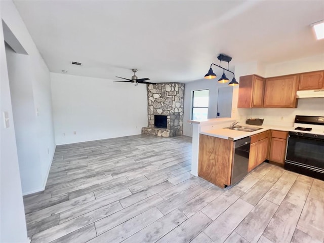 809 Bracewood Cir, San Marcos, TX 78666 - kitchen with under cabinet range hood, open floor plan, gas range, dishwashing machine, and a sink