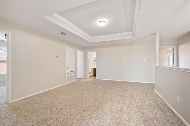 100 Snowy Egret Ln, Leander, TX 78641 - carpeted spare room featuring a tray ceiling, crown molding, and baseboards