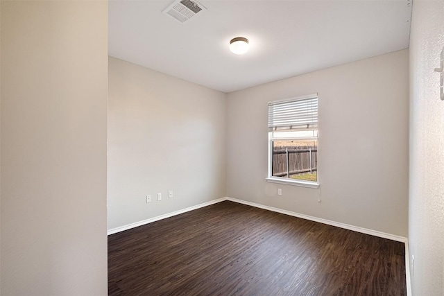 100 Snowy Egret Ln, Leander, TX 78641 - empty room featuring dark wood finished floors and baseboards