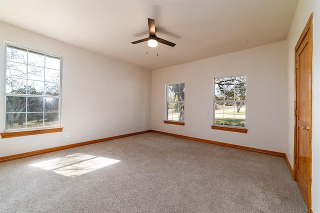 unfurnished bedroom featuring baseboards, light colored carpet, and ceiling fan