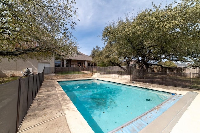 view of pool with fence and a fenced in pool