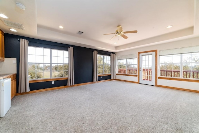 212 Cassidy Dr S, Georgetown, TX 78628 - unfurnished room with a raised ceiling, light colored carpet, baseboards, a ceiling fan, and recessed lighting