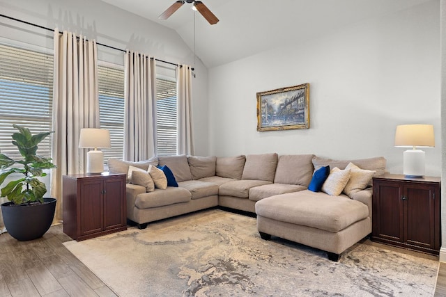 living room with vaulted ceiling, ceiling fan, and wood finished floors