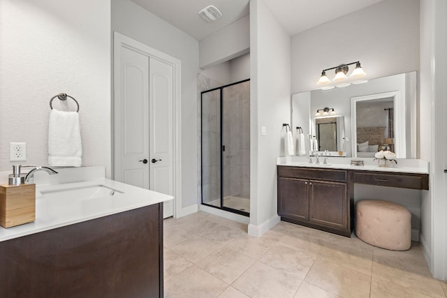 bathroom featuring visible vents, baseboards, vanity, and a shower stall